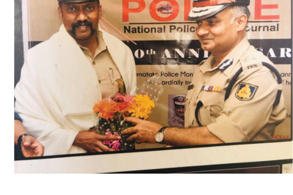 Felicitated for social service — Honoured for his social-service work at a Karnataka State Police event.